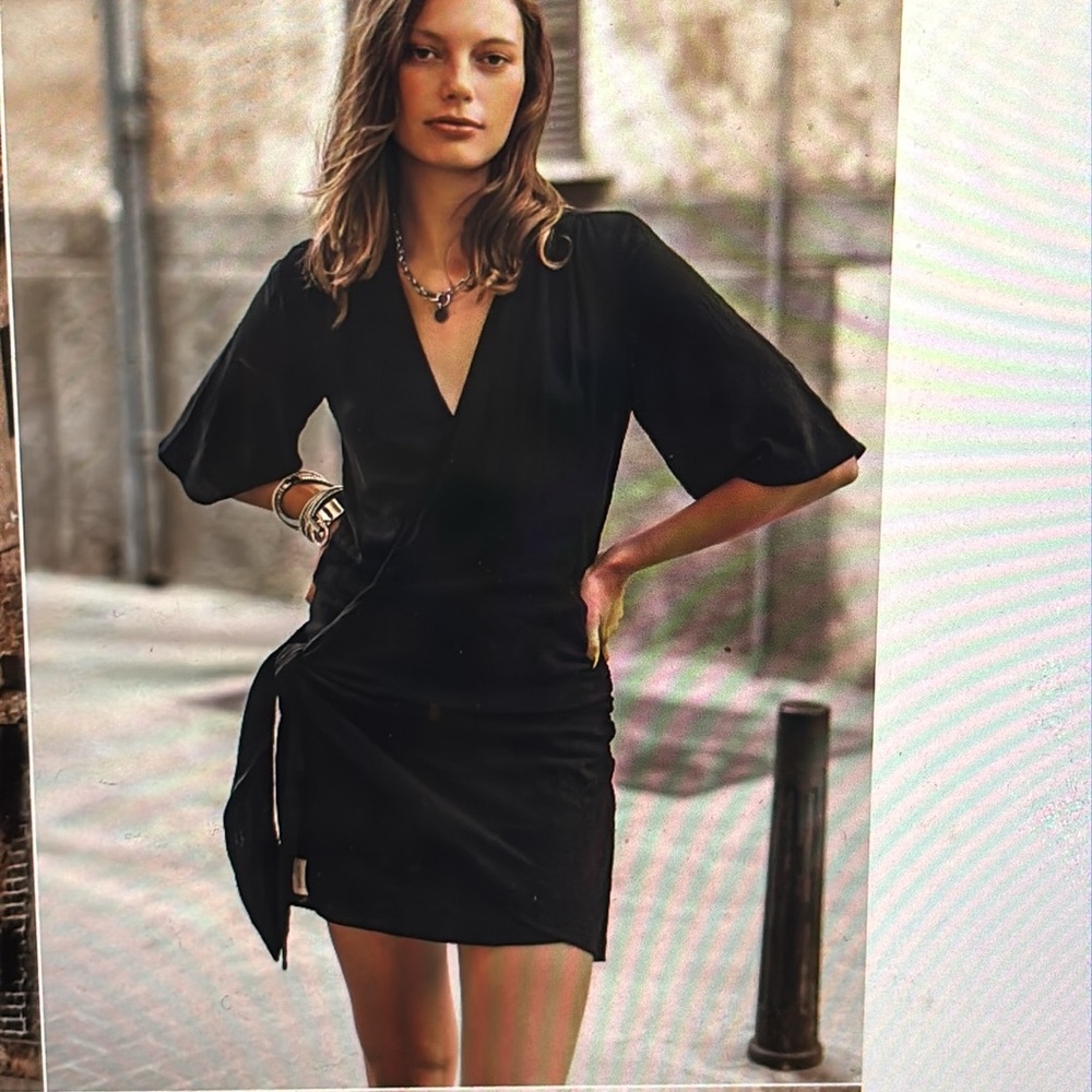 Mikuta black wrap dress sold out online sells for 220 when in stock.